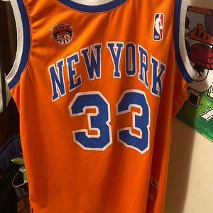 Orange blue and white knicks jersey